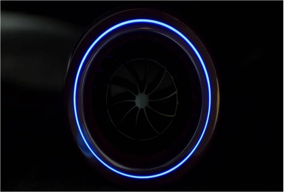 A blue illuminated ring that provides even illumination. There is a vent in the centre.