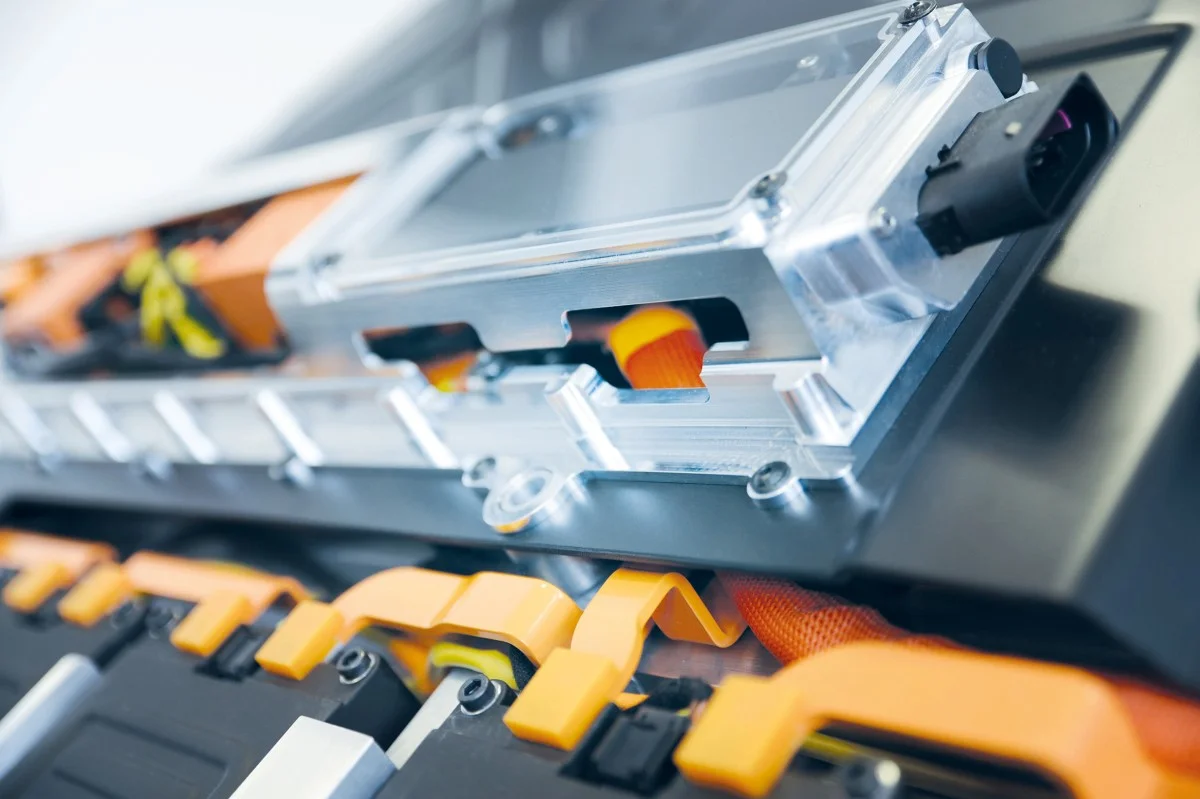 Close-up of a battery with orange components.