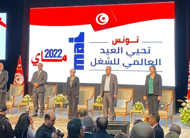 Five people lined up in front of one chair each. Prizes are awarded in Tunisia. 