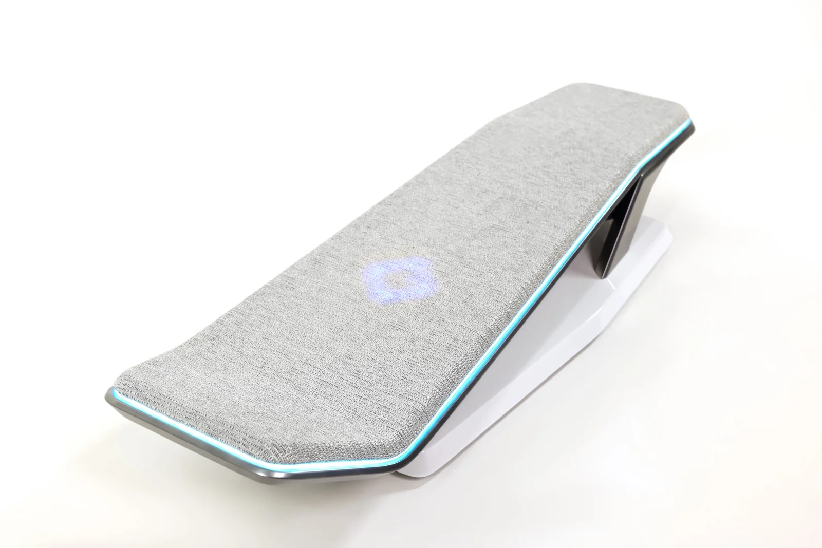 A grey, rectangular armrest with blue LED lights on the edges and a white base.