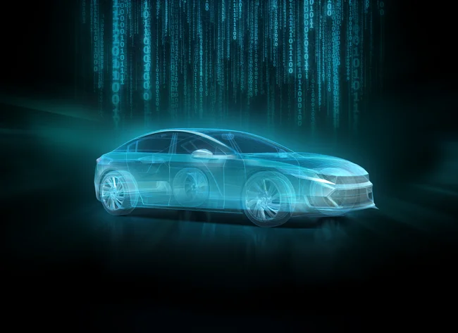 DRÄXLMAIER key visual. Turquoise car in front of a black background.