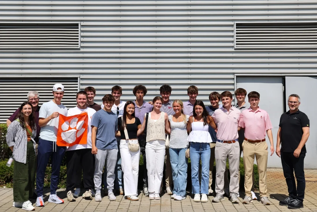 Group photo of students in front of the factory in Landau