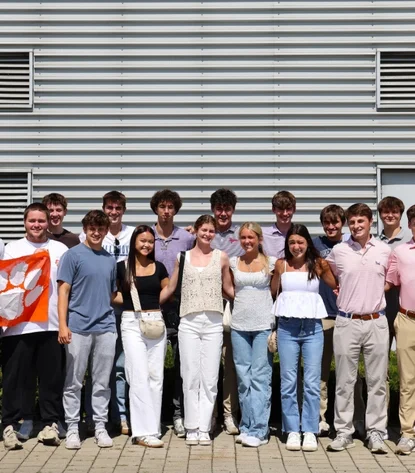 Group photo of students in front of the factory in Landau