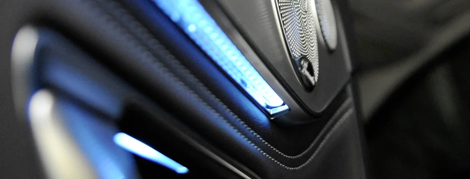 A modern car interior with stylish ambient lighting that creates a warm and inviting atmosphere.