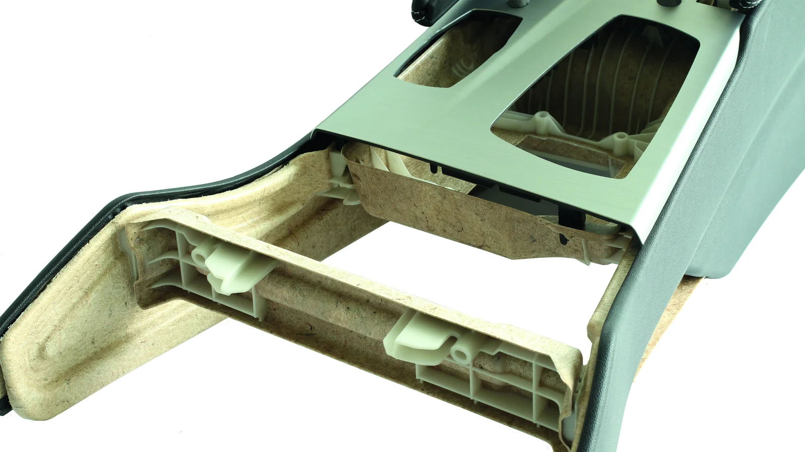 A not yet finished centre console of a vehicle with clear lines made of natural fibres.
