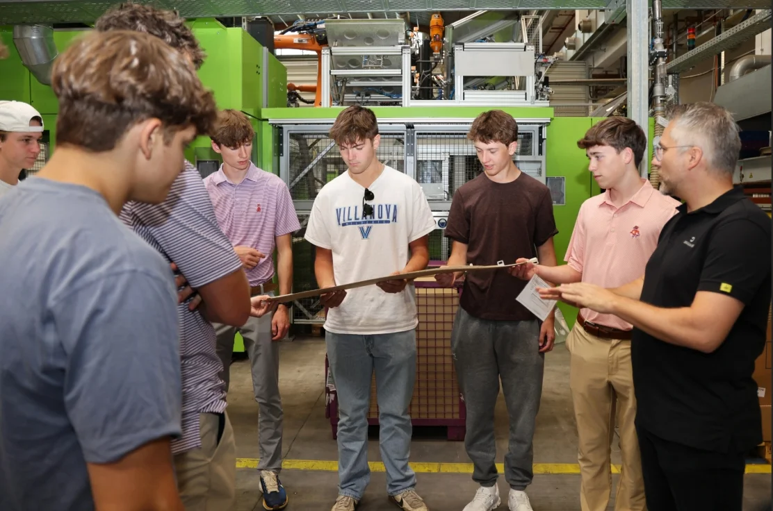 Students on a tour of the factory in Landau