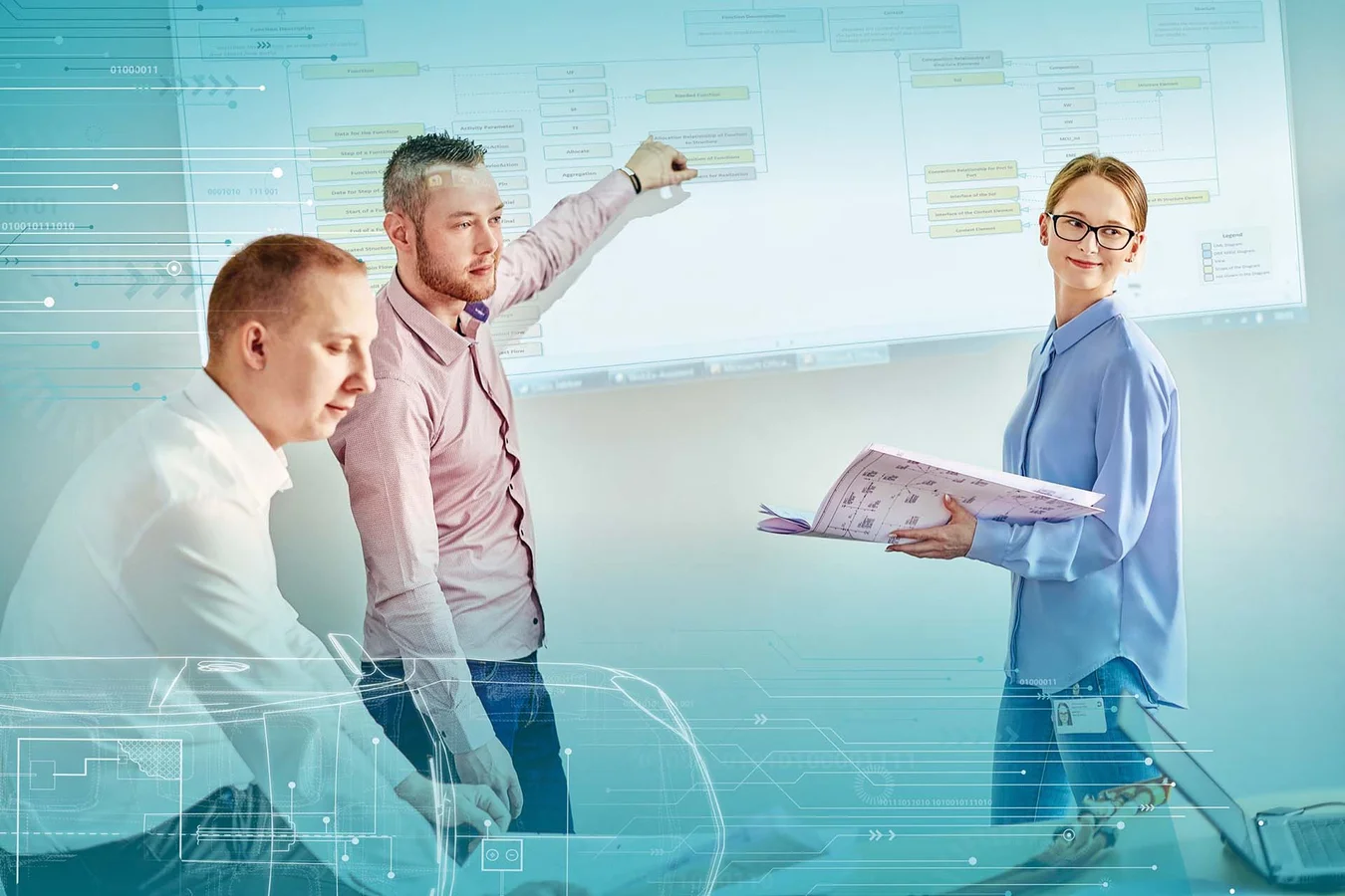 Three employees give a presentation that is projected onto a wall. One employee holds a plan.