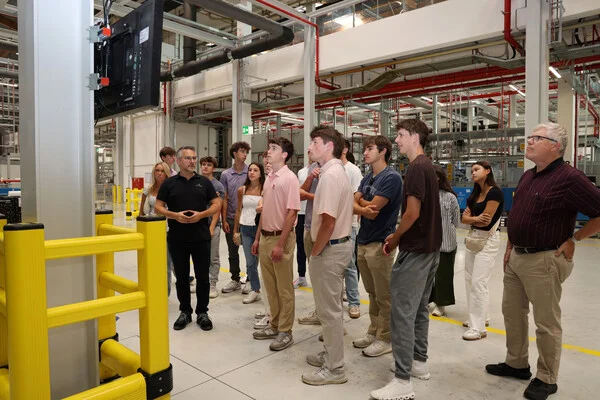 Students on a tour of the factory in Landau