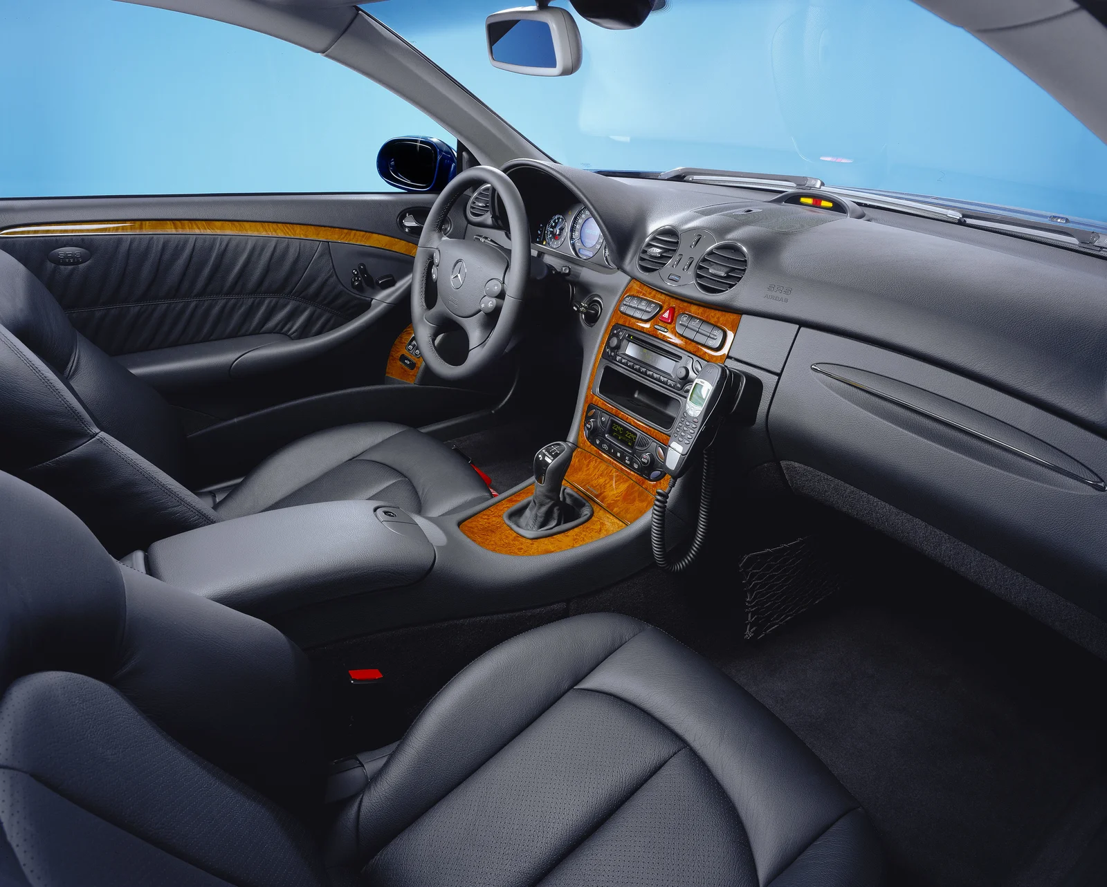 Shows a black cockpit of a Mercedes Benz. 